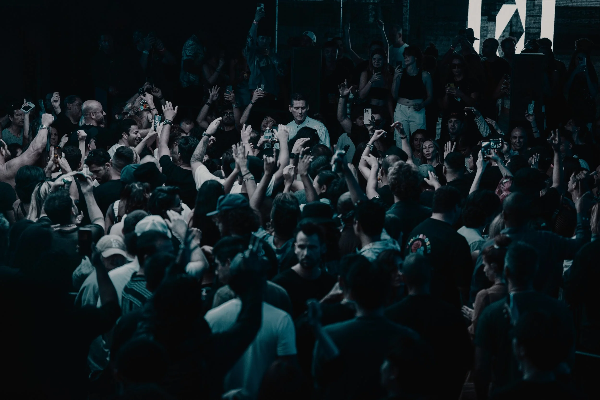 Vibrant party atmosphere with colorful lights and dancing crowd